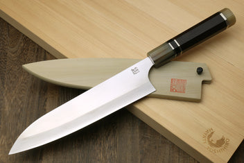 Gyuto chef knife with polished stainless blade and ebony handle, triple ring style