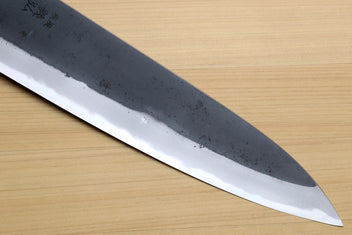 Kurouchi-finished blue steel gyuto blade with sharp point and plain cutting edge