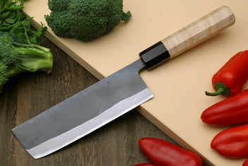 Nakiri vegetable knife angled view, black handle and gray stainless-steel blade