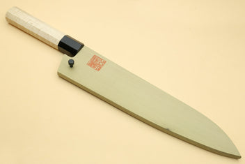 Gyuto chef knife with pale camphor wood handle and dark blade edge