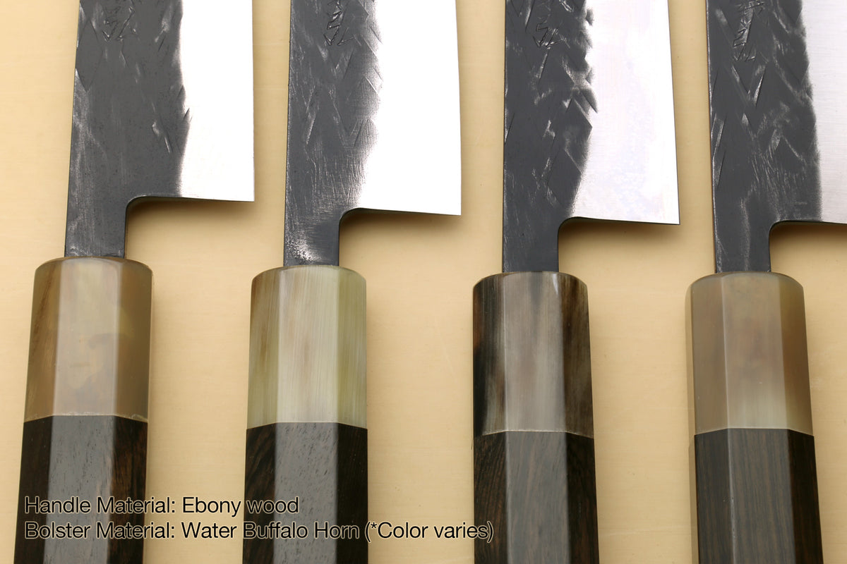 Knife set handle close-up with dark wood bolster and rectangular black grips on stainless blades