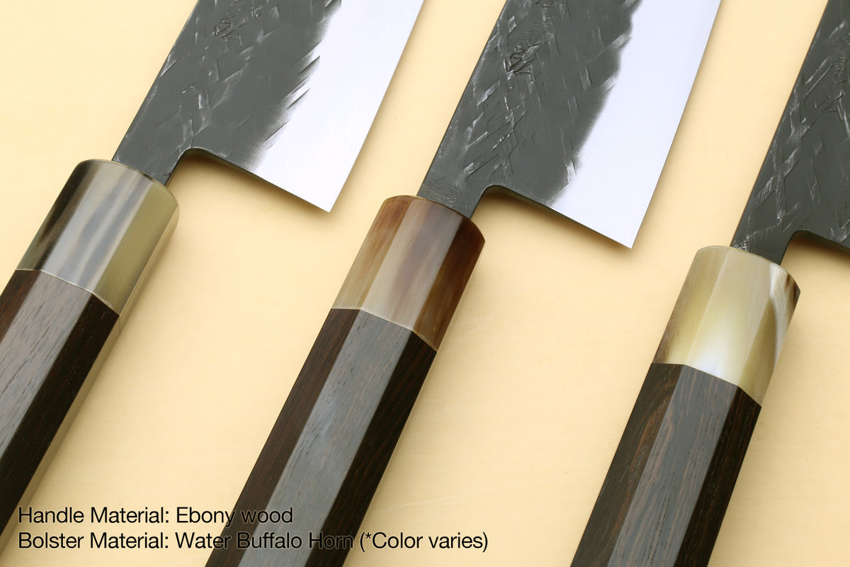 Pair of knives with ebony-wood handles, dark horn bolster, and textured blades