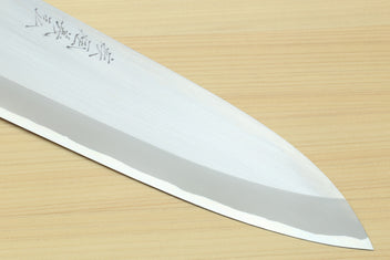 Deba knife close-up of white steel blade with etched text near the spine