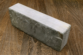 Natural sharpening whetstone block, dark gray with pale top surface