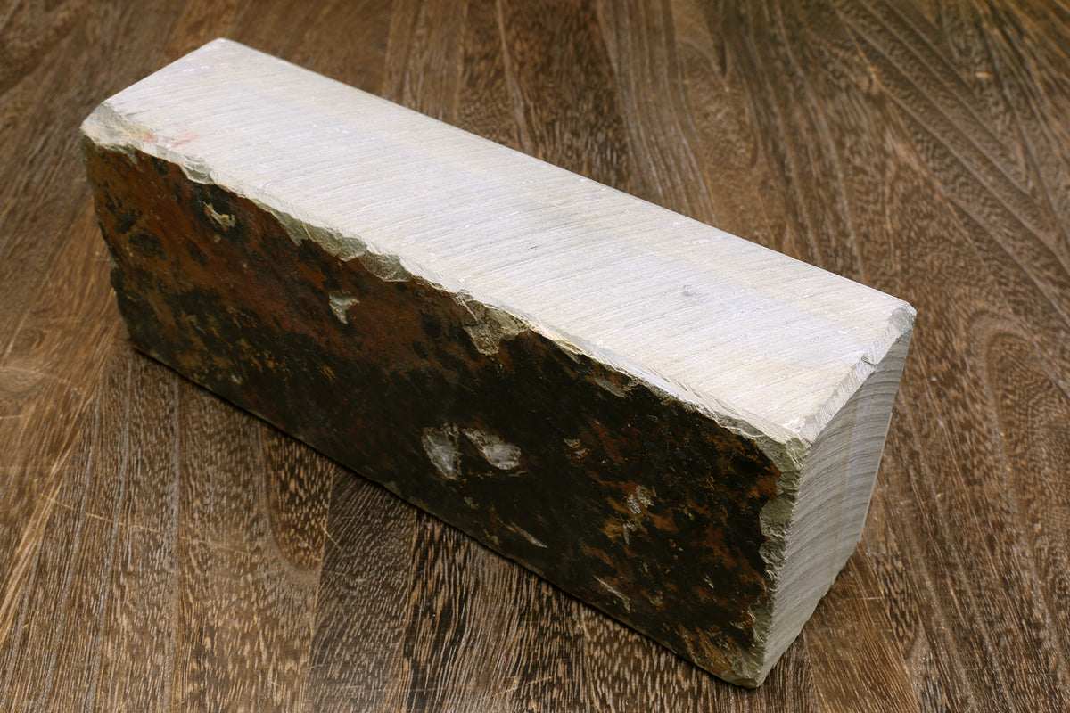 Natural sharpening whetstone, rectangular block, light top with dark side