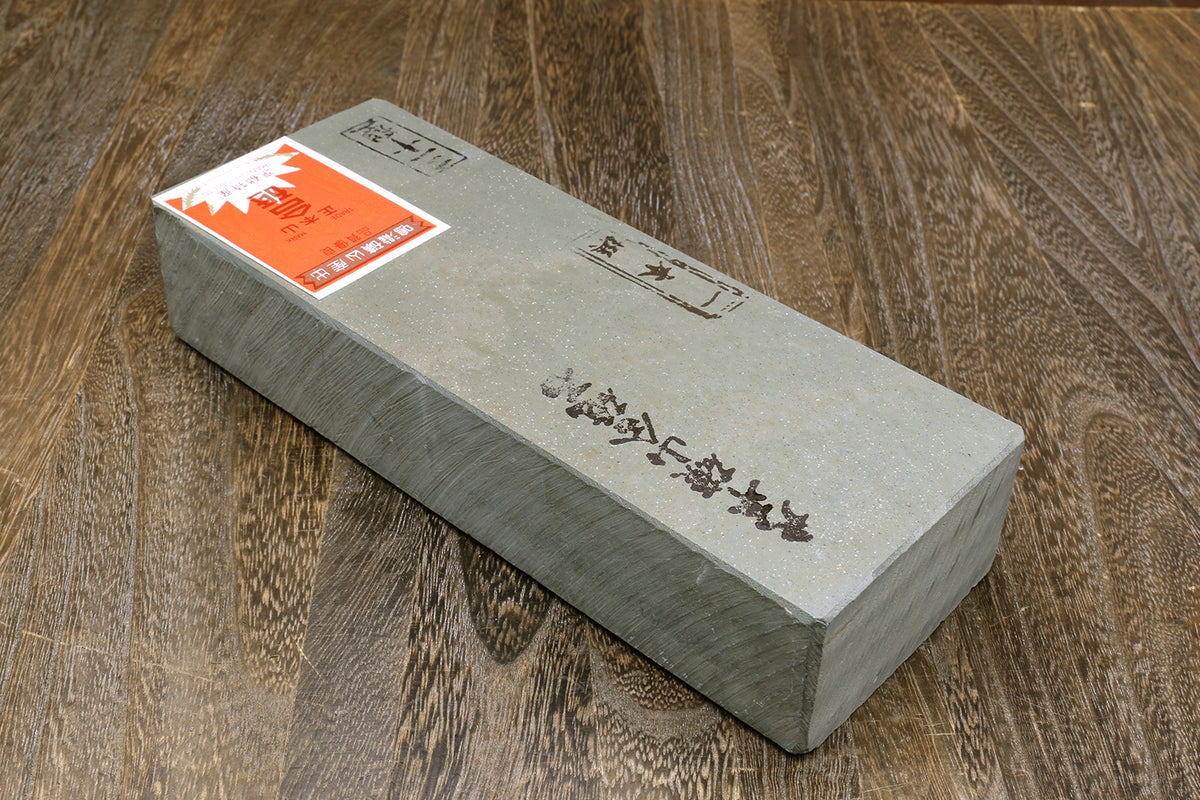 Natural sharpening whetstone finishing block, gray stone with orange label