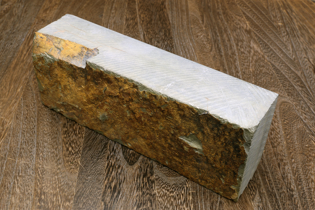 Natural whetstone block, white top with brown sides and rough edges