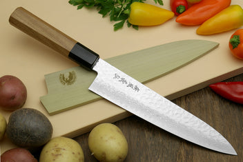 Damascus gyuto chef knife with ambrosia wooden handle and black bolster, tip view