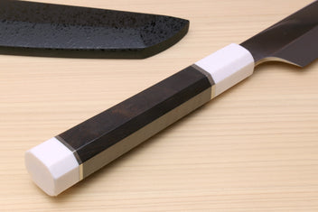 Japanese sushi sashimi knife with ebony handle, white bolster, and dark blade
