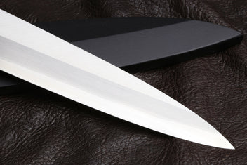 Yanagi sushi knife blade close-up with stainless steel edge