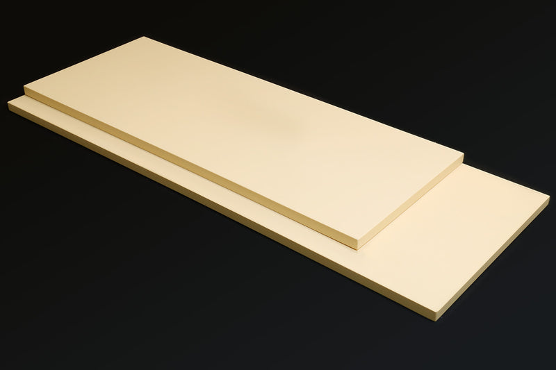 Cream Japanese cutting board with raised center section and flat top surface.