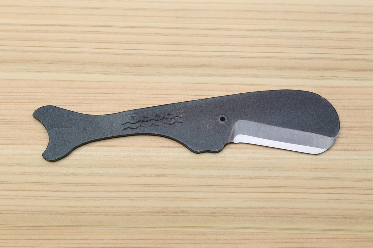Whale-shaped Japanese utility knife with dark kurouchi finish and curved steel blade