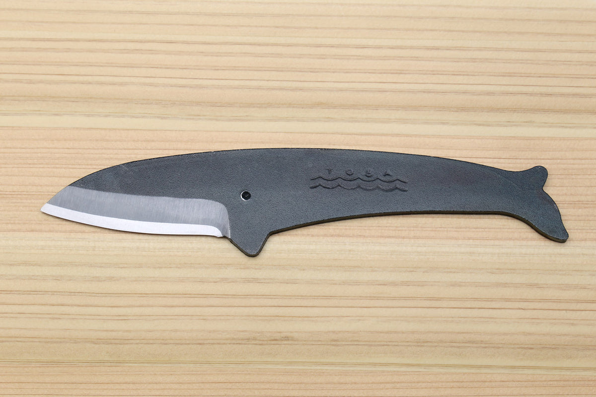 Whale utility knife with dark blue handle, silver blade edge, wavy emblem