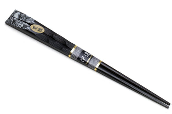 Japanese black chopsticks with dragon motif near tips