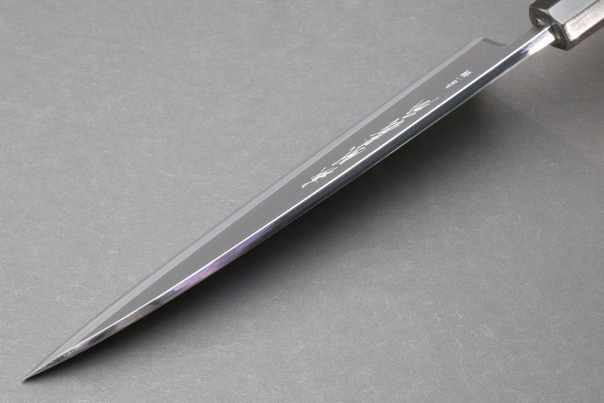 Japanese chef knife side profile with polished steel blade
