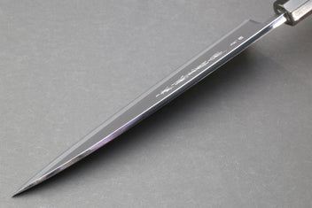 Japanese chef knife side profile with polished steel blade