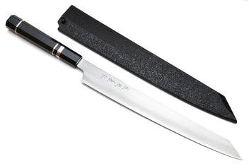 Kiritsuke slicer knife with white blade, dark ebony handle, and black sheath