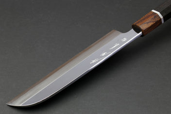 Japanese chef knife side view with mirror-polished blade and ebony handle