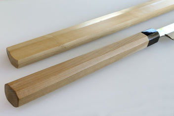 Single-edged tuna knife with light wood handle and dark steel blade