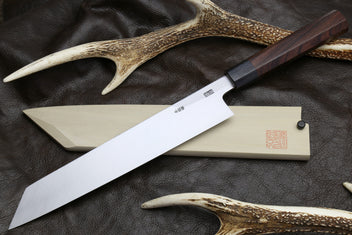 Japanese chef knife set: pale blade with dark handle, with matching horn-like guards