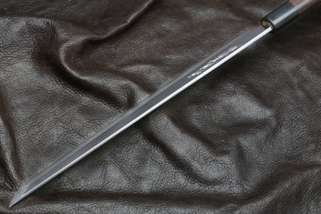 Japanese sushi knife with light steel blade and rosewood handle, tip view
