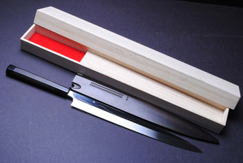 Mirror-finished steel Japanese knife in light wooden box with red insert