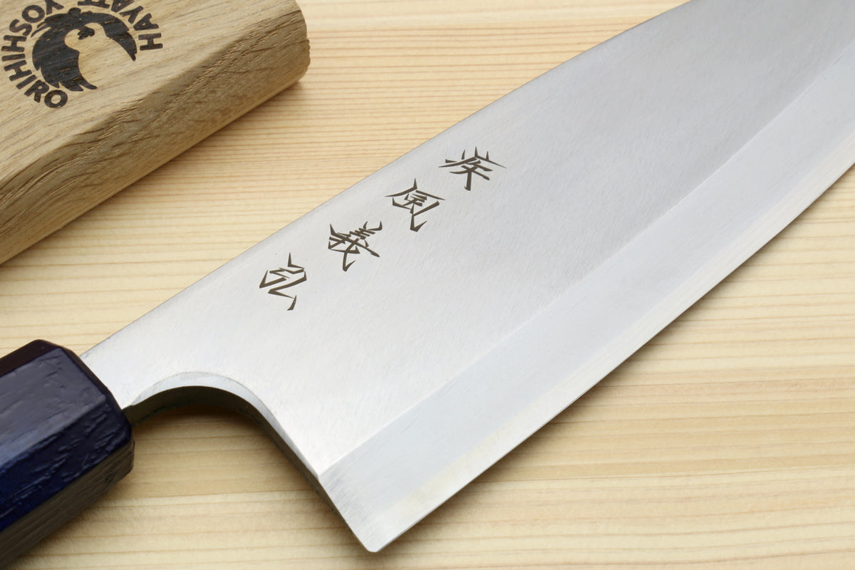 Japanese deba knife showing etched characters on stainless blade