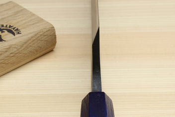 Japanese deba knife tip and dark blue handle detail