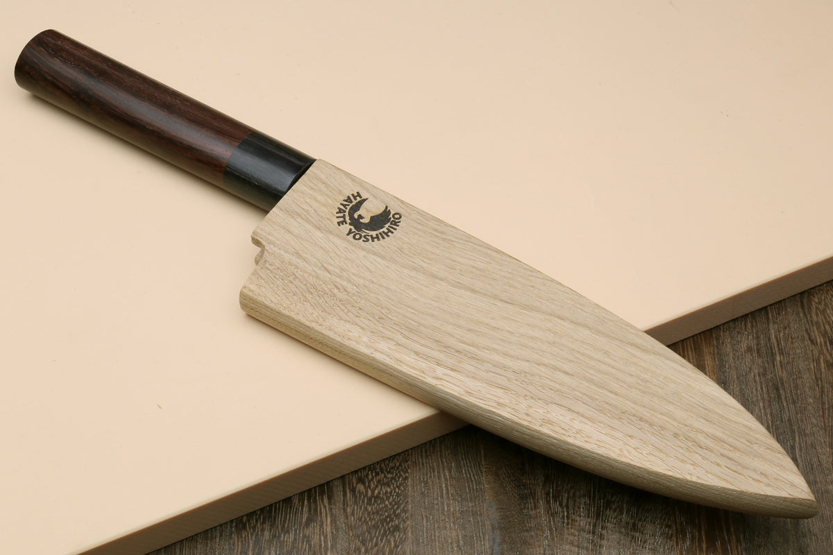 Deba knife with white blade, dark rosewood handle, and light protective sheath