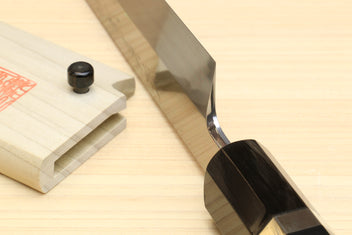 Yanagi-kiritsuke knife with dark ebony handle and mirror-finished steel blade