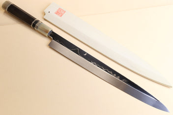 Japanese kitchen knife with dark handle and silver ring ferrules