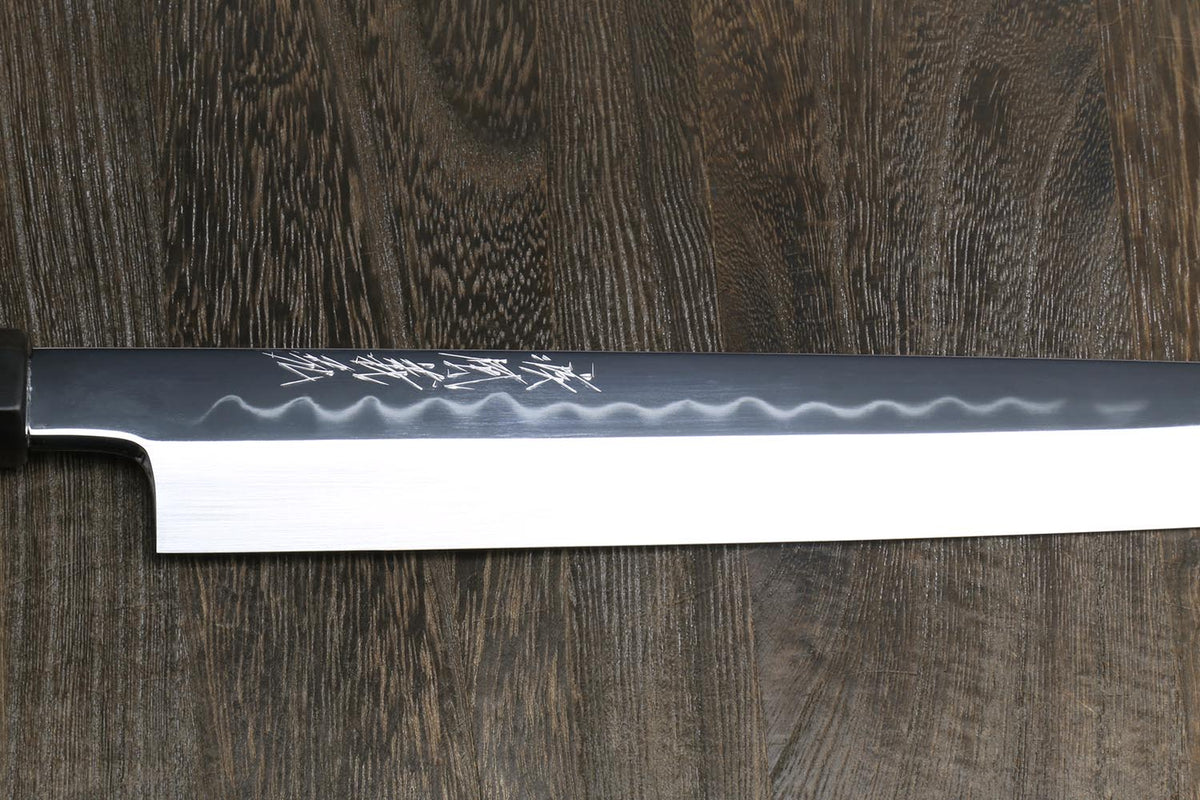 Yanagi knife blade side view, hammered white steel with mirror polish