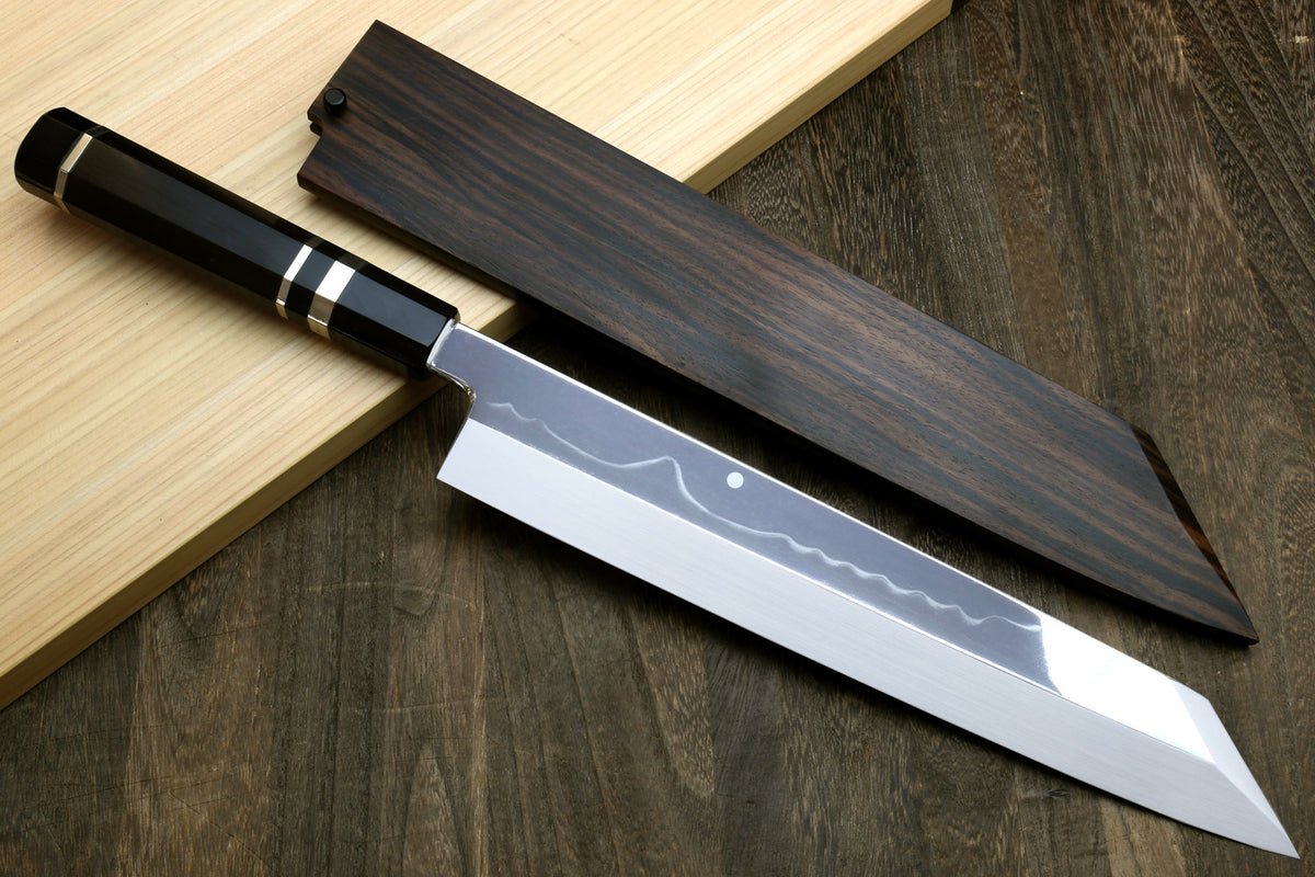 Kiritsuke chef knife with polished white steel blade and matching dark saya sheath