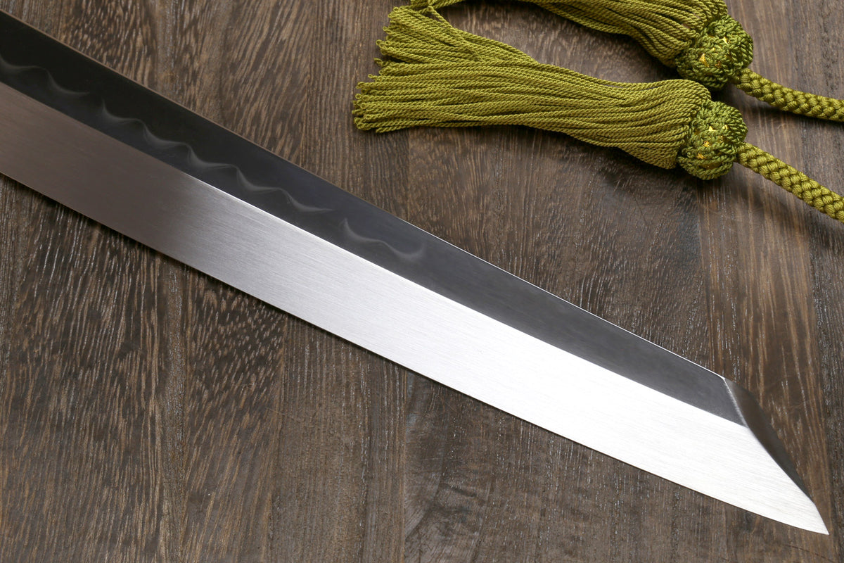 White steel sushi knife blade with mirror-polished finish and dark handle section