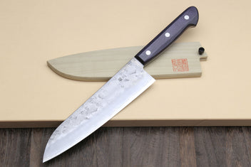 Santoku knife with dark blue handle and silver curved blade