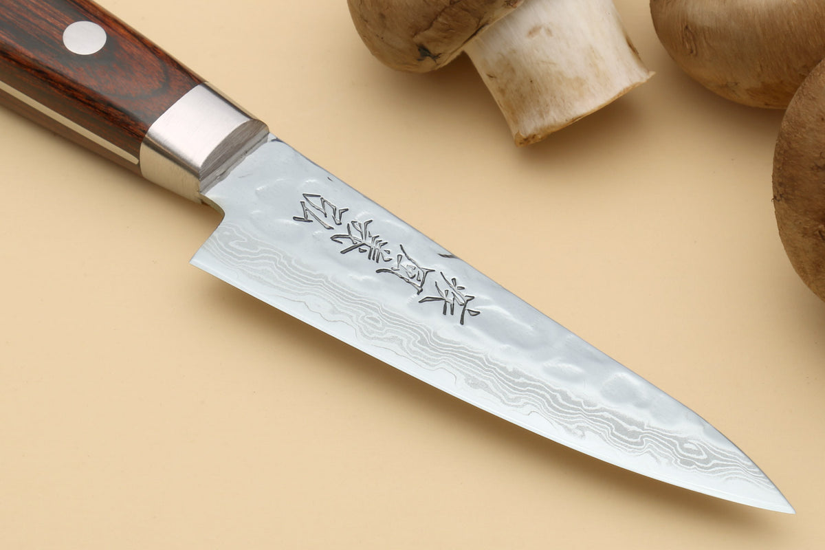 Damascus stainless steel paring knife blade with hammered texture and engraved script