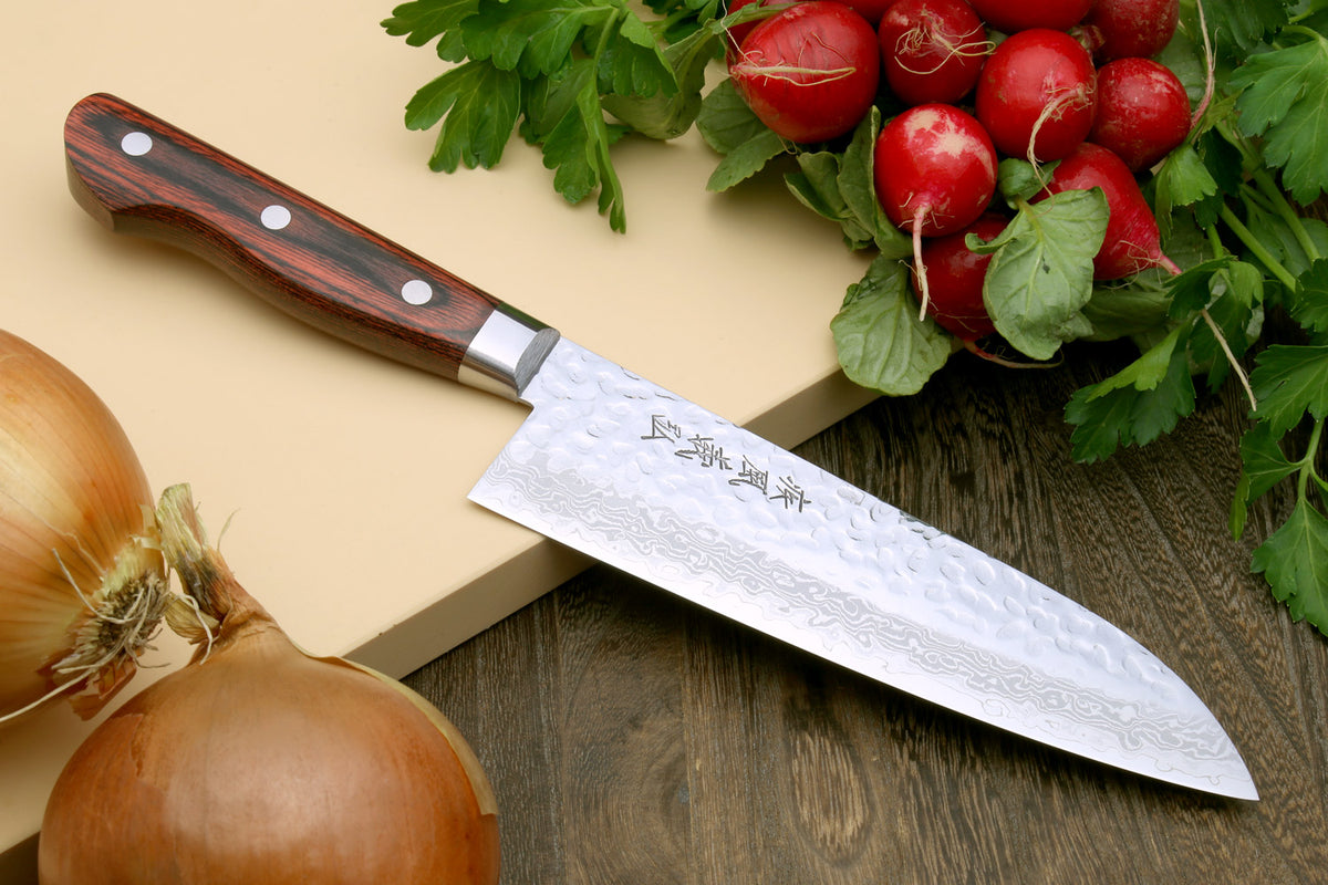 Damascus santoku knife with dark wood handle and long silver hammered blade