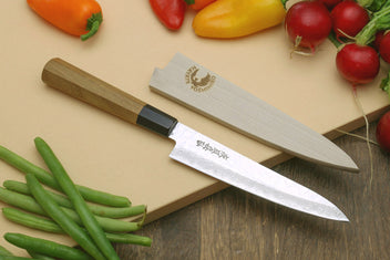 Damascus gyuto knife with ambrosia wooden handle and black bolster, angled close-up