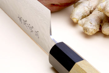 Damascus gyuto chef's knife with black bolster and light octagonal handle